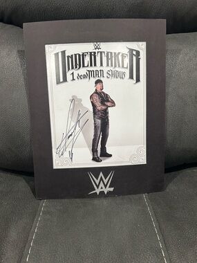 The Undertaker WWE 100% authentic autograph guaranteed!